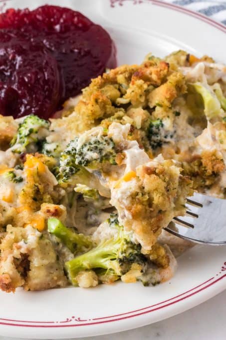 A bite of broccoli, stuffing and chicken.